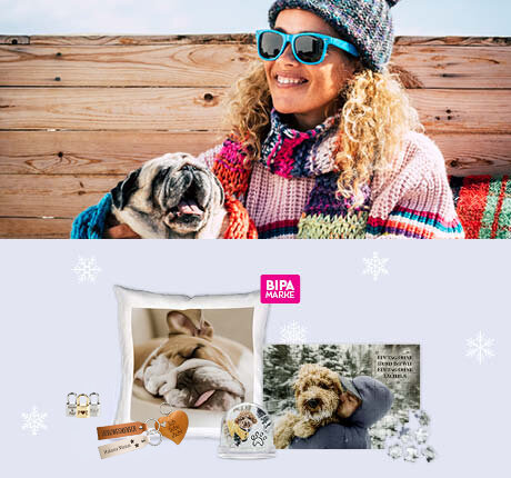 Frau mit Hund im Schnee, darunter Fotogeschenke wie Kissen, Tasse, Puzzle und Schneekugel im BIPA Fotoshop gestalten.